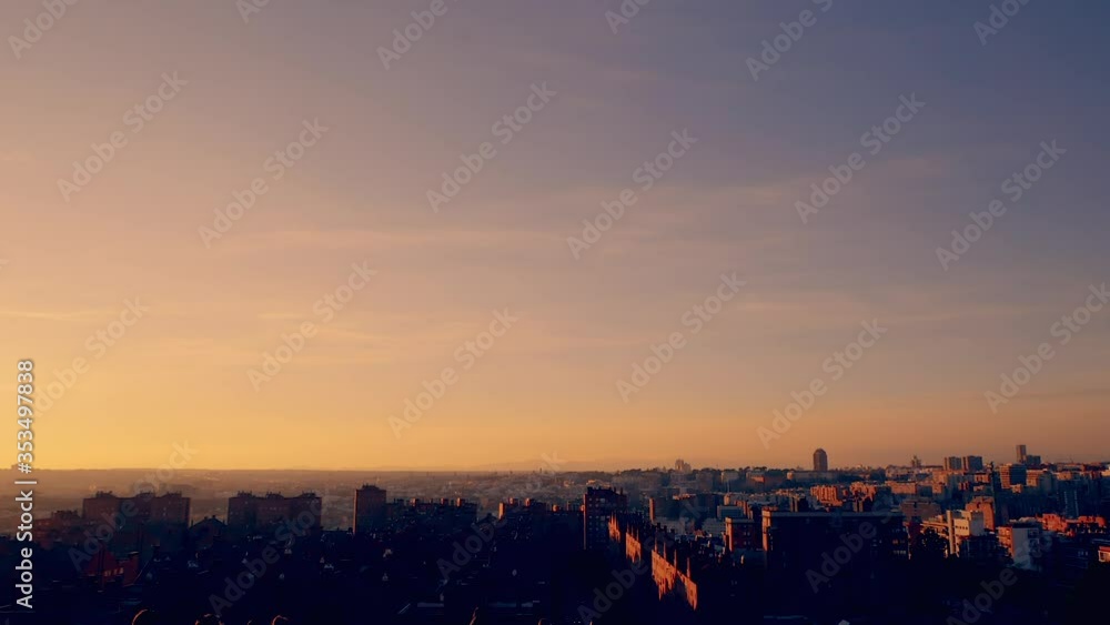 Enjoying sunset and sports at park with Madrid, Spain skyline in the background Enjoying sunset and sports at park with Madrid, Spain skyline in the background