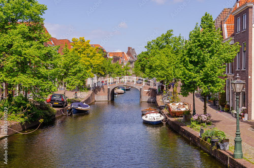 River canal with boats in Leiden. Holland.