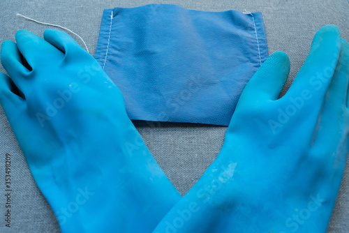 Blue gloves and facemark worn during the coronavirus pandemic  photo
