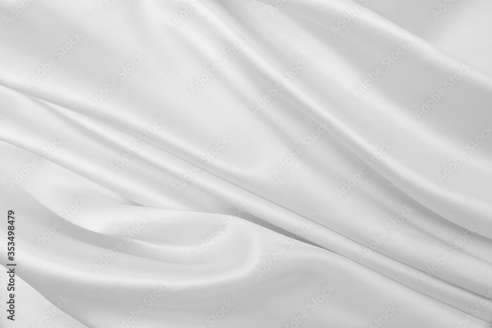 Smooth elegant white silk or satin luxury cloth texture as wedding background. Luxurious background design Smooth elegant white silk or satin luxury cloth texture as wedding background. Luxurious background design
