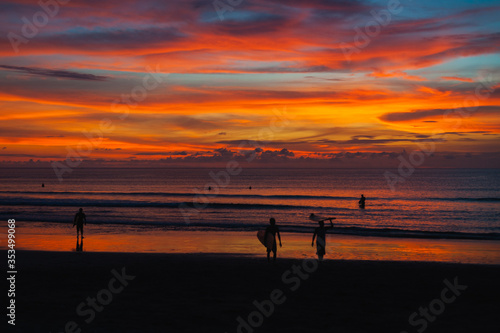 Wallpaper Mural Black silhouette of a surfers with a board on the ocean beach Torontodigital.ca