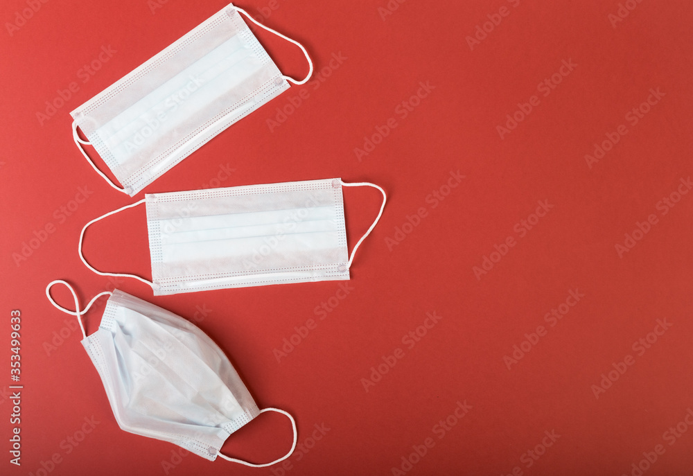 Two medical masks used and unused are on an isolated background Two medical masks used and unused are on an isolated background