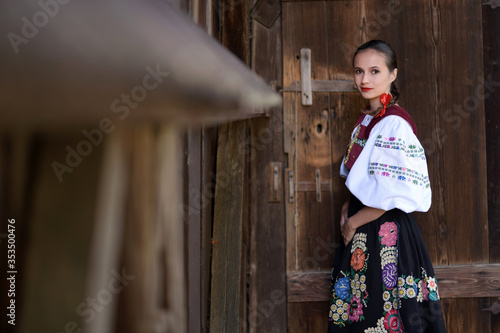 Young beautiful slovak woman in traditional costume. Slovak folklore. photo