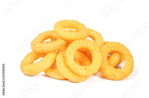 Delicious ring snacks isolated on white background. Pile of yellow unhealthy junk food