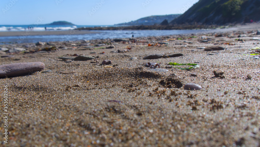 View across a sand and pebble beach to the sea, Cornwall UK View across a sand and pebble beach to the sea, Cornwall UK