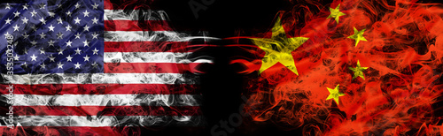 Photography American and Chinese flags in smoke shape on black background