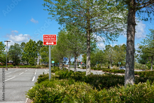 Valokuva A faculty parking sign in a parking lot