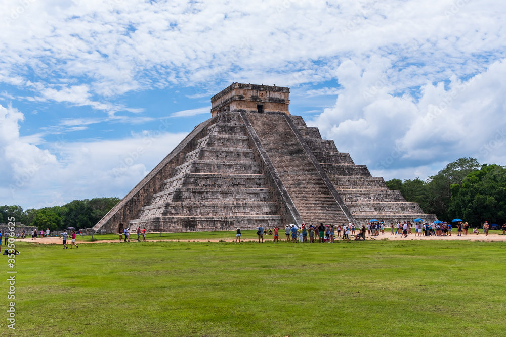 View of the Kukulcan pyramid in the Mayan archeological area of Chichen Itza (Yucatan, Mexico). View of the Kukulcan pyramid in the Mayan archeological area of Chichen Itza (Yucatan, Mexico).