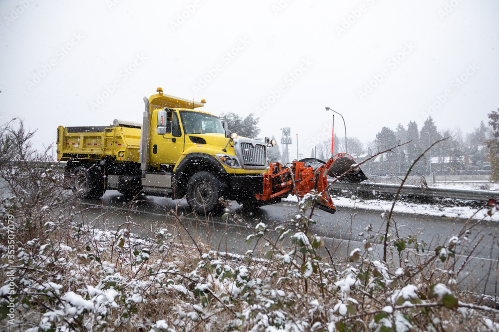 Snowplow truck on a freeway onramp Snowplow truck on a freeway onramp