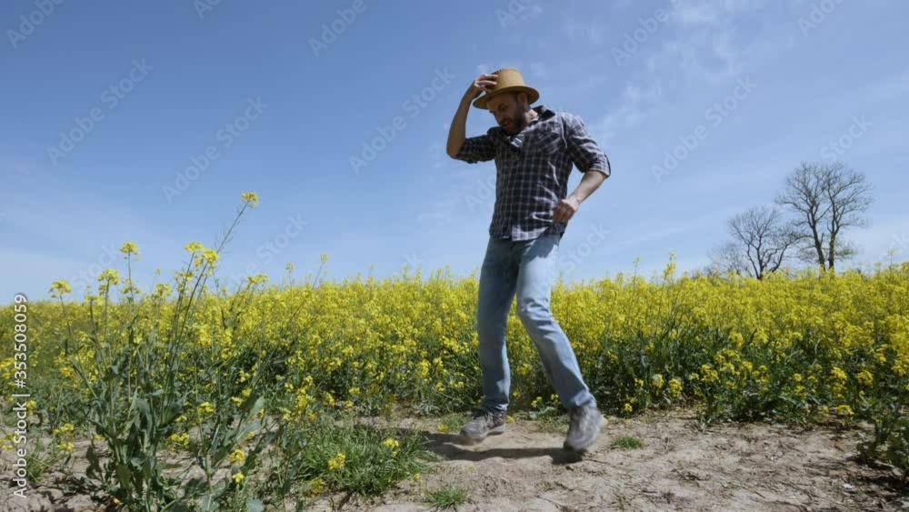 Happy Man Farmer Dancing Enjoying at Rape Blossom On Field. Fun Celebrating Funny Viral Dance Freedom. Guy Enjoying Dance. Joyful Man Farmer Dancing. Flowering Rapeseed Field Blue Sky. Happy Man Farmer Dancing Enjoying at Rape Blossom On Field. Fun Celebrating Funny Viral Dance Freedom. Guy Enjoying Dance. Joyful Man Farmer Dancing. Flowering Rapeseed Field Blue Sky.