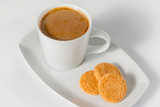 Cup of coffee and honey cookies isolated