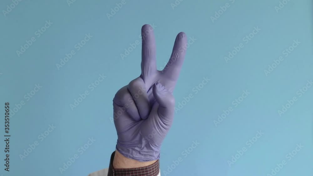 hand of doctor in a white coat and gloves isolated against the blue background and counting from 0 to 5. concept of the final countdown hand of doctor in a white coat and gloves isolated against the blue background and counting from 0 to 5. concept of the final countdown