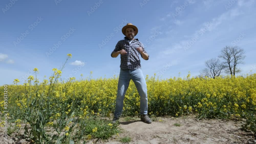 Happy Man Farmer Dancing Enjoying at Rape Blossom On Field. Fun Celebrating Funny Viral Dance Freedom. Guy Enjoying Dance. Joyful Man Farmer Dancing. Flowering Rapeseed Field Blue Sky. Happy Man Farmer Dancing Enjoying at Rape Blossom On Field. Fun Celebrating Funny Viral Dance Freedom. Guy Enjoying Dance. Joyful Man Farmer Dancing. Flowering Rapeseed Field Blue Sky.