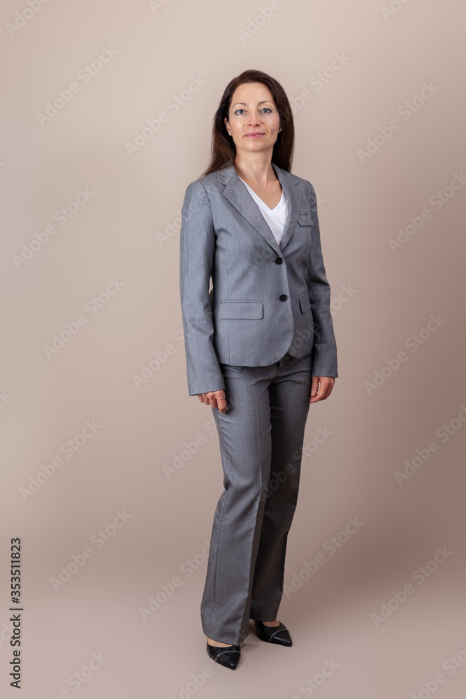 portrait of a beautiful woman or business woman lady in gray suit. portrait of a beautiful woman or business woman lady in gray suit.