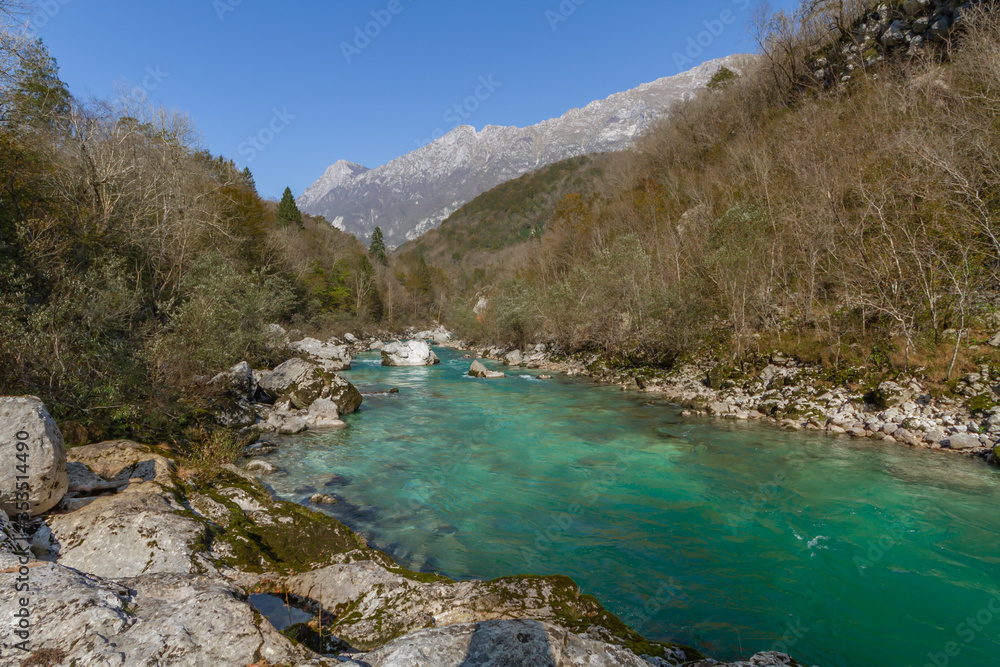 Kobarid, Slovenia - October 28, 2014: The Soca river flows through western Slovenia and its source lies in the Julian Alps. One of the most beautiful rivers in Europa, known for its emerald color. Kobarid, Slovenia - October 28, 2014: The Soca river flows through western Slovenia and its source lies in the Julian Alps. One of the most beautiful rivers in Europa, known for its emerald color.