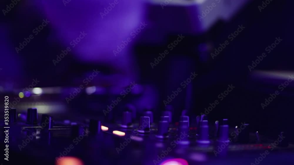 Dj playing music during party in nightclub Dj playing music during party in nightclub