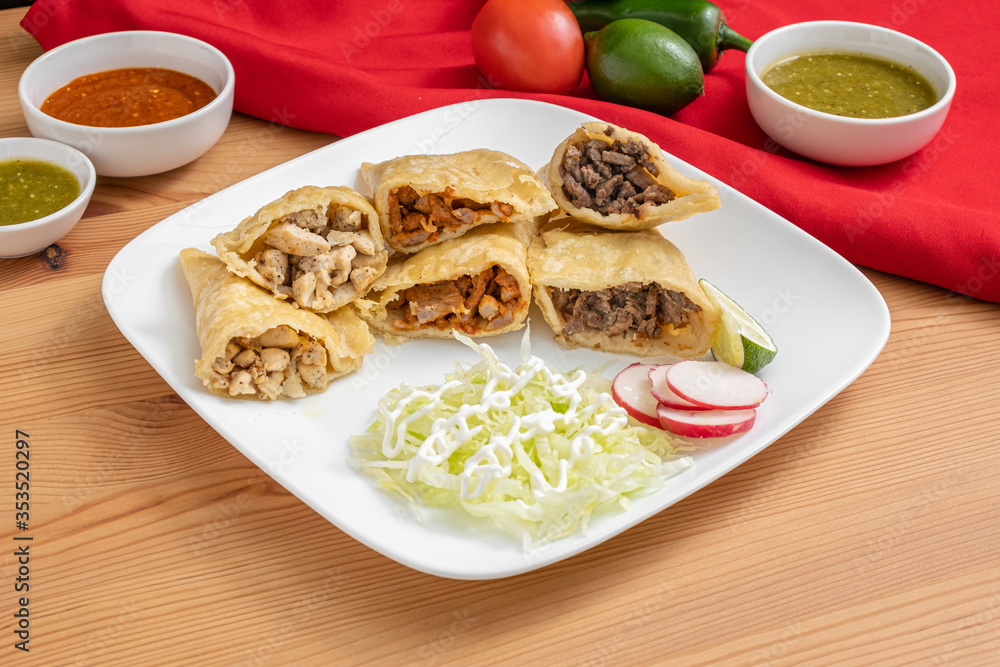 Mexican empanada plate with chicken, pork, and beef empanadas. A traditional Mexican dish in a colorful and vibrant setting. Mexican empanada plate with chicken, pork, and beef empanadas. A traditional Mexican dish in a colorful and vibrant setting.