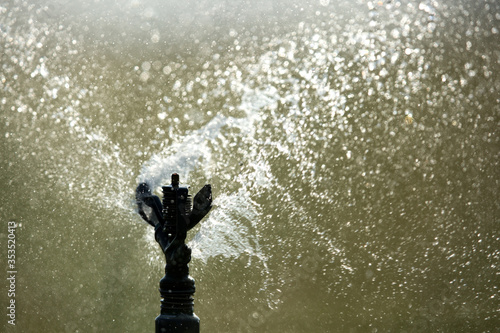 Closeup of Water sprinkler spraying water