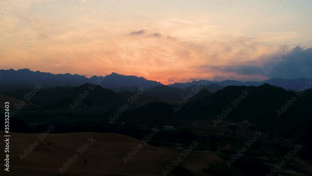 Aerial view of sunset above sand dunes Al Madam, Sharjah, United Arab Emirates