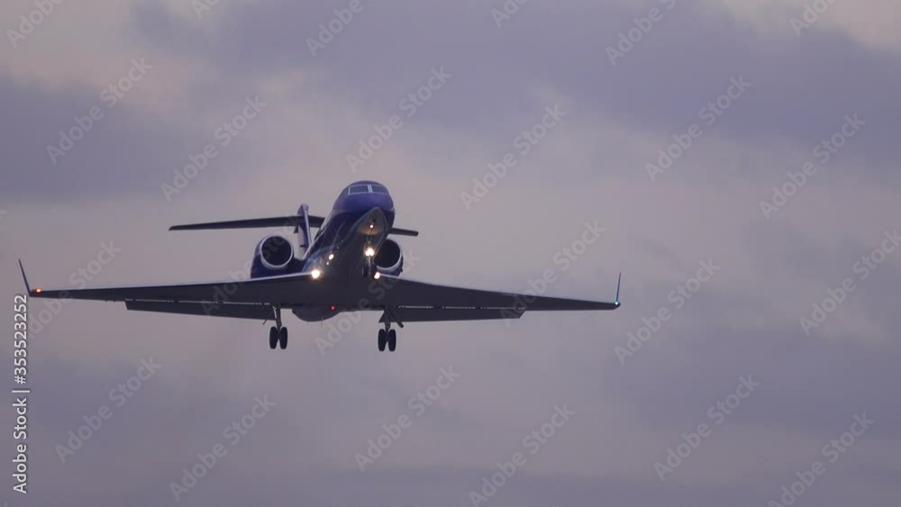 Business jet (private jet) taking off at dusk Business jet (private jet) taking off at dusk
