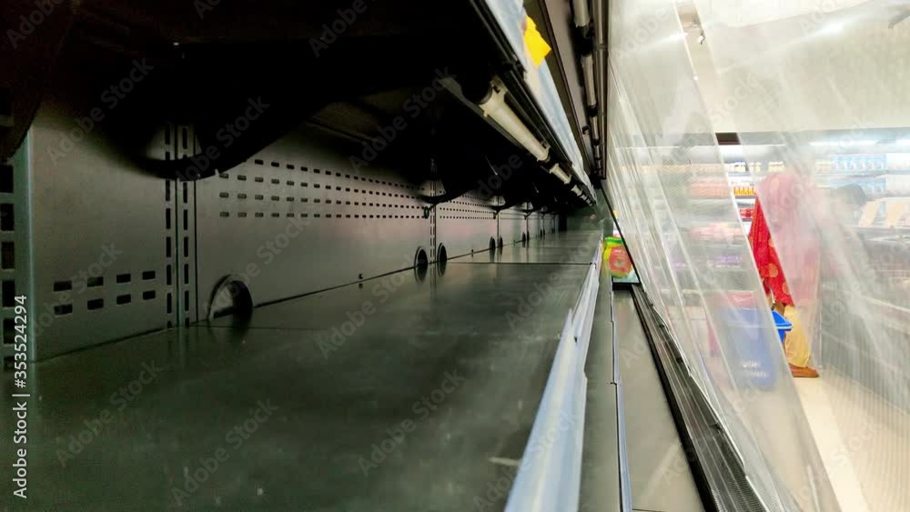 Empty shelves at a grocery store due to panic buying and shortage of supplies amid coronavirus pandemic Empty shelves at a grocery store due to panic buying and shortage of supplies amid coronavirus pandemic
