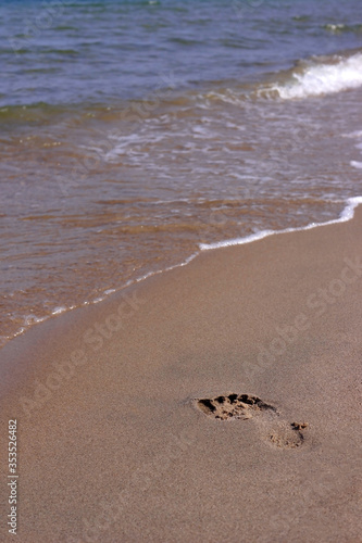 Footprint on the sand at the beach.