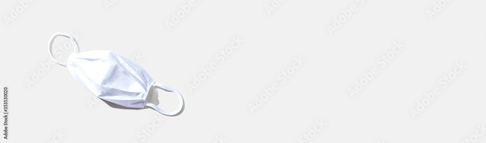 White surgical mask overhead view - flat lay White surgical mask overhead view - flat lay