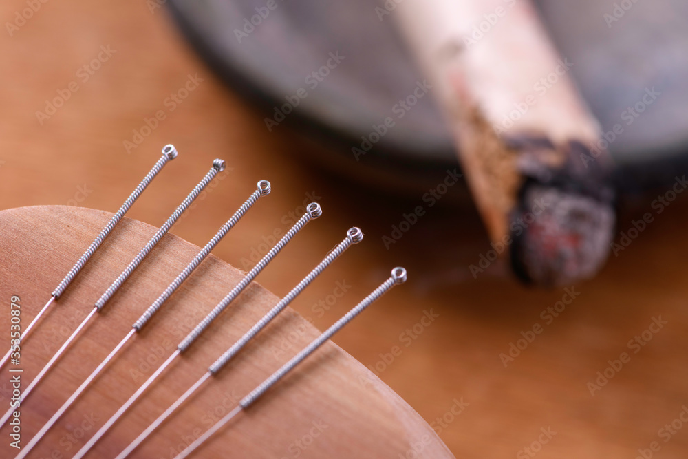 Wall Mural Traditional China acupuncture needles and moxa stick