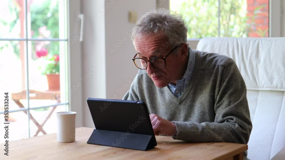 Senior man doing a video chat using digital tablet
Senior man doing a video chat using digital tablet