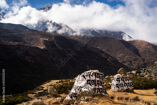 Stones carved with prayers reading, 