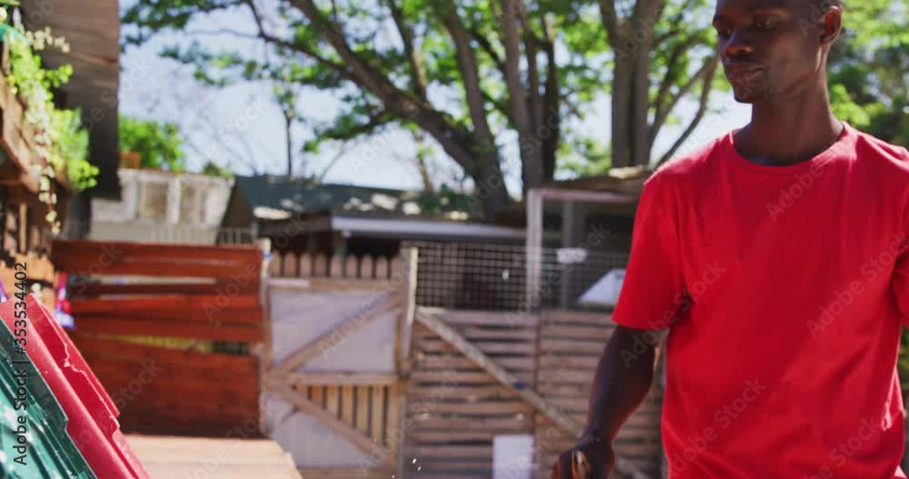 African American volunteer man in a dog shelter African American volunteer man in a dog shelter
