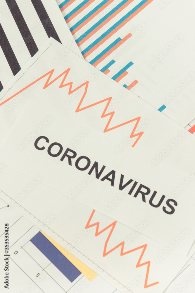 Inscription coronavirus and downward graphs representing financial crisis caused by Covid-19. Risk of recession around world Inscription coronavirus and downward graphs representing financial crisis caused by Covid-19. Risk of recession around world