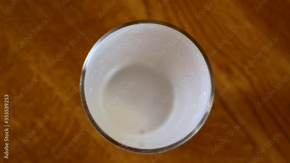 empty glass cup of kefir probiotik drink placed onto kitchen tabletop empty glass cup of kefir probiotik drink placed onto kitchen tabletop