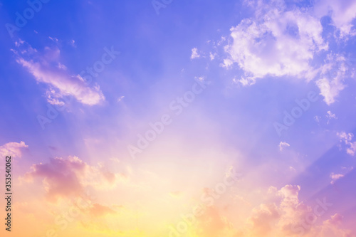 sky and clouds nature background,purple blue sky with sun beam light and yellow color