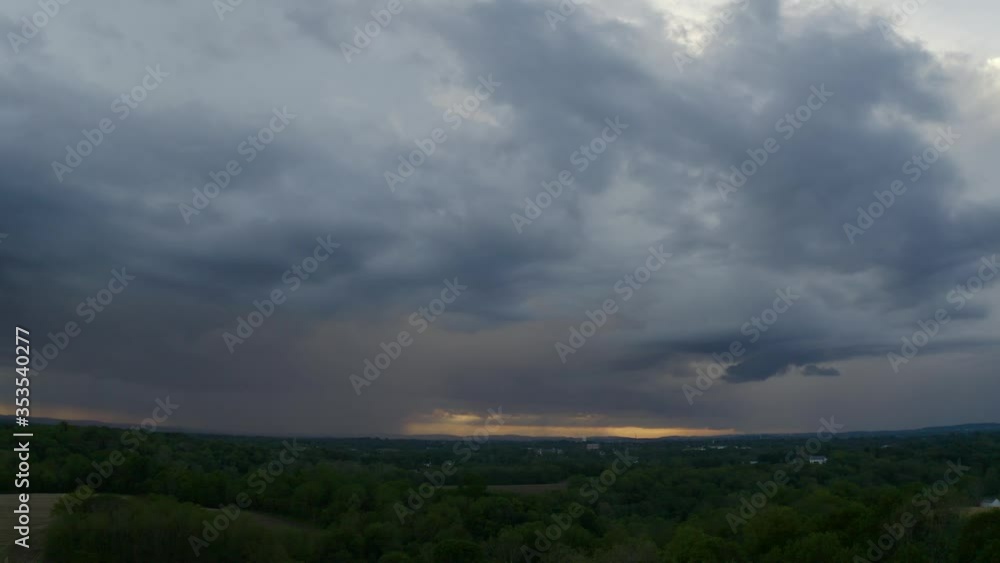 Storm Clouds Form At Sunset Over Farm Land Aerial 4K Storm Clouds Form At Sunset Over Farm Land Aerial 4K