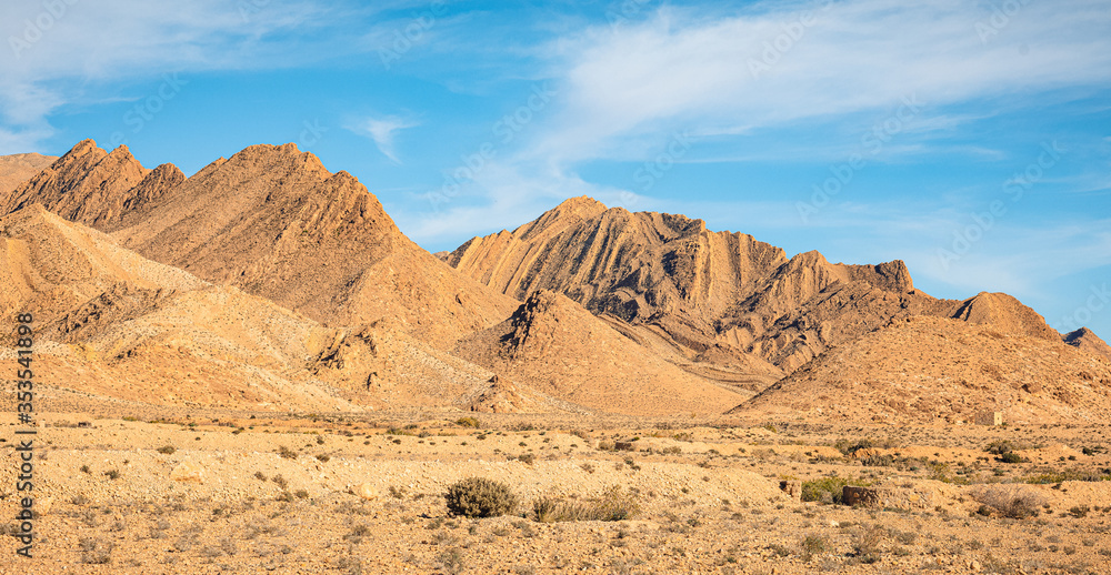 Tunisian desert with mountains and yellow sand Tunisian desert with mountains and yellow sand