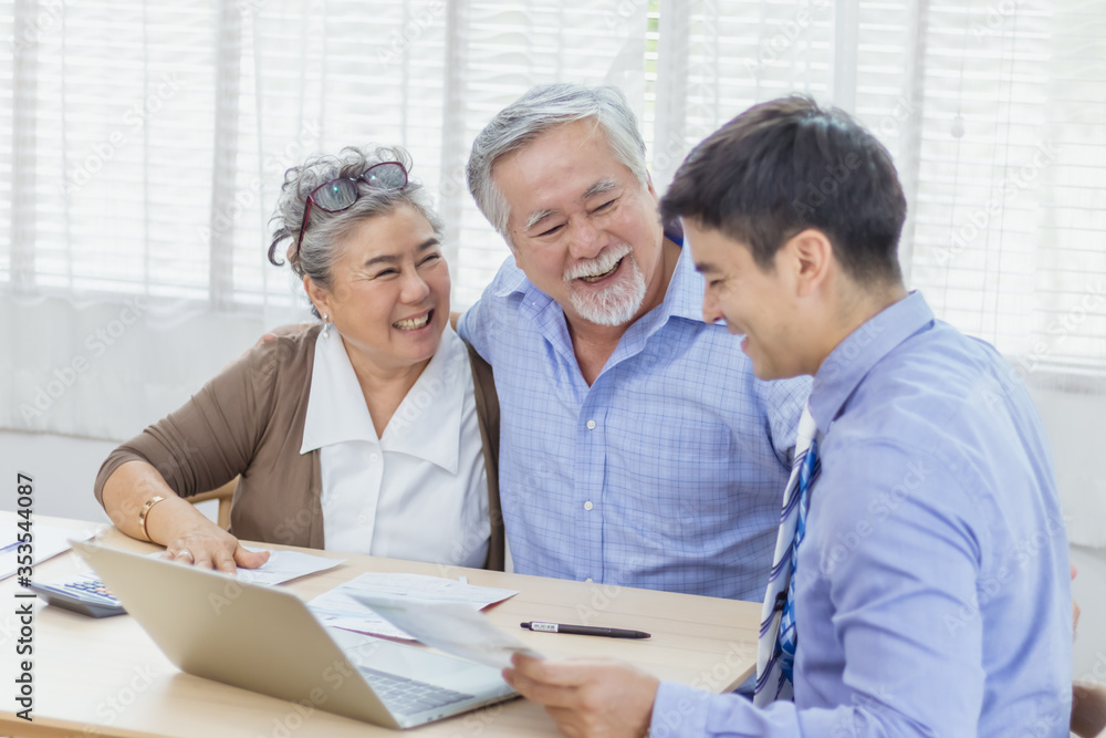 Fototapeta premium Happy retired Asian senior eldery couple consult with personal financial advisor or real estate agent. Retirement investment planning with professional counseling. Home loan and mortgage concept