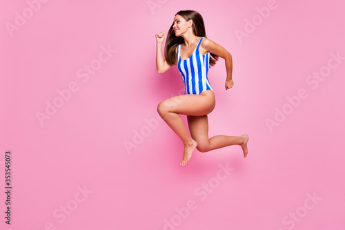 Full length body size view of nice attractive stunning slender thin motivated energetic cheerful cheery straight-haired girl jumping running isolated over pink pastel color background
