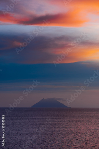 Photo of sunset above a mountain somewhere along the coast of Papua New Guinea 