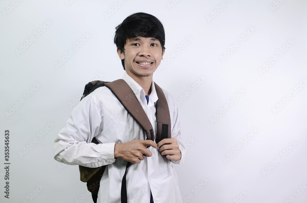 Young Asian men wearing white shirts and carrying bags isolated on a white background. Man's expression is cheerful and full of enthusiasm
Young Asian men wearing white shirts and carrying bags isolated on a white background. Man's expression is cheerful and full of enthusiasm