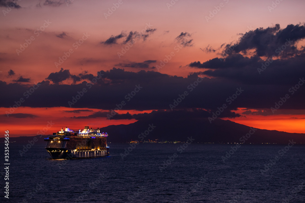 Photo of a ship at sunset shot from Manila bay, Philippines Photo of a ship at sunset shot from Manila bay, Philippines