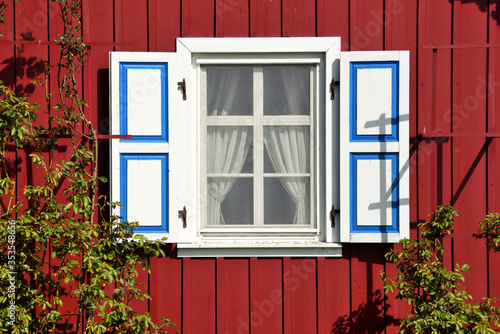 Wooden rustic window in small cottage house