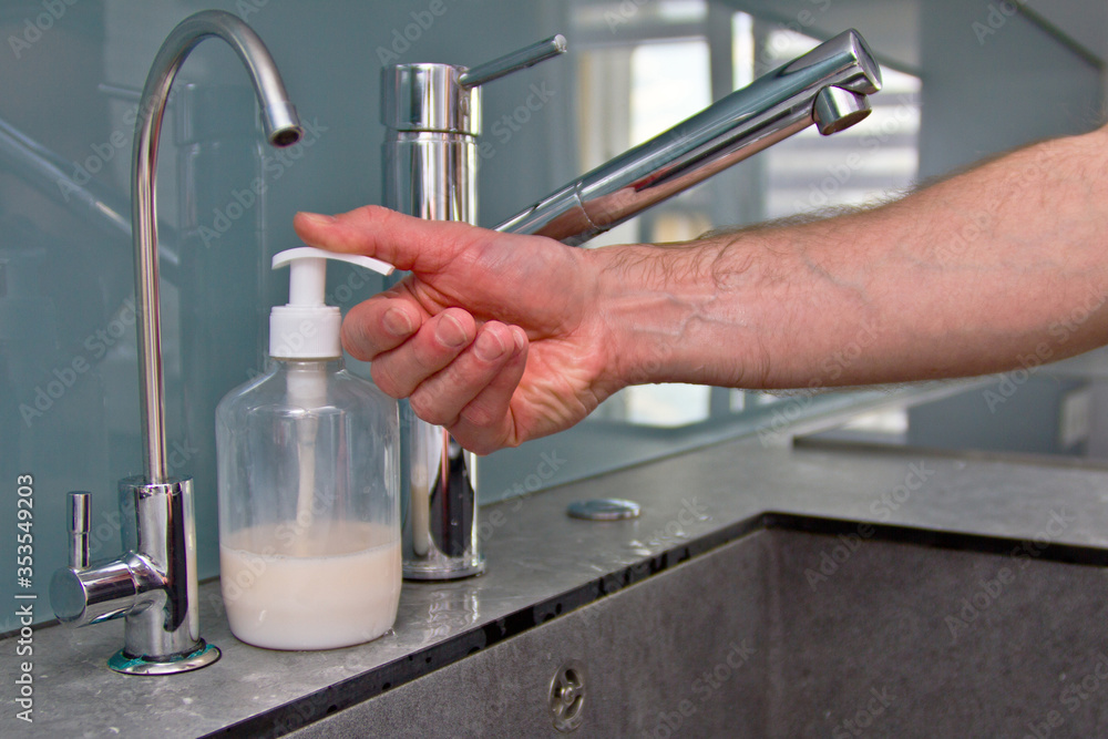 Man washing soapy, men's hands with running water Man washing soapy, men's hands with running water