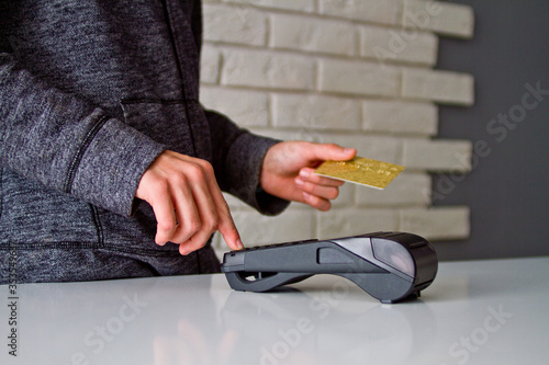The process of payment for goods through the Terminal. Plastic card. Enter the password