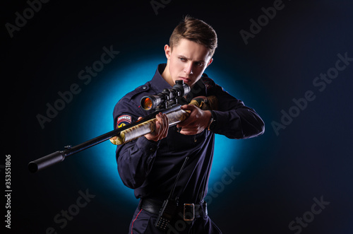 a guy in a police uniform with a sniper rifle. english translation Police 