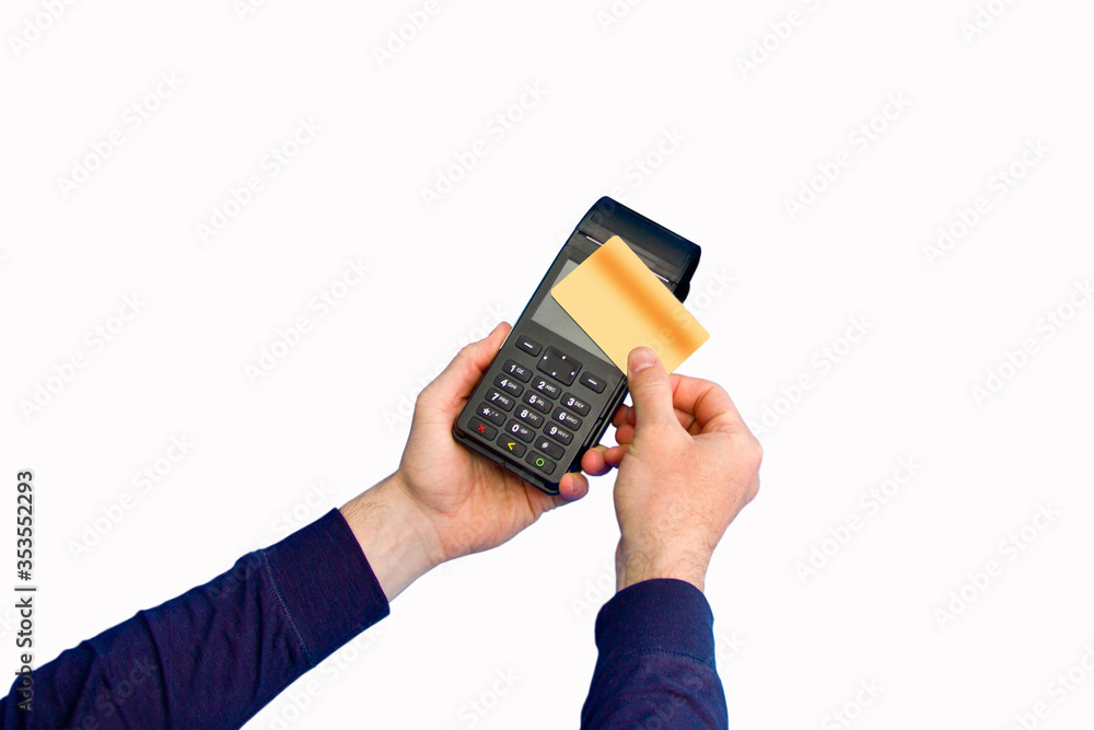 The hand holds a credit card on the payment terminal. Isolated on white background The hand holds a credit card on the payment terminal. Isolated on white background