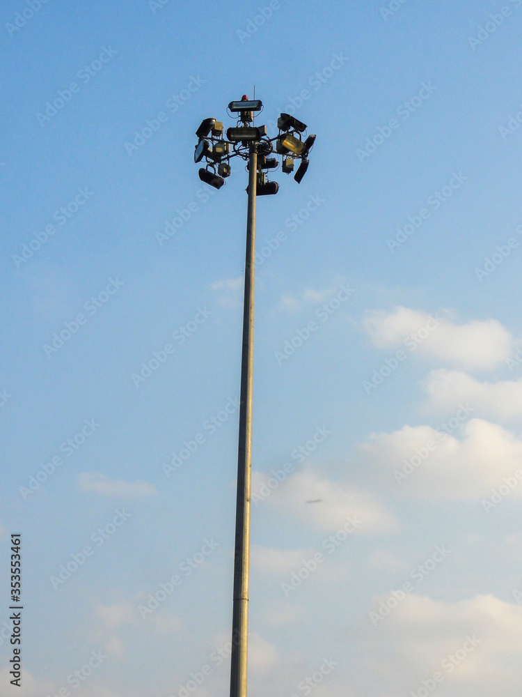 The lights tower on height side of the road