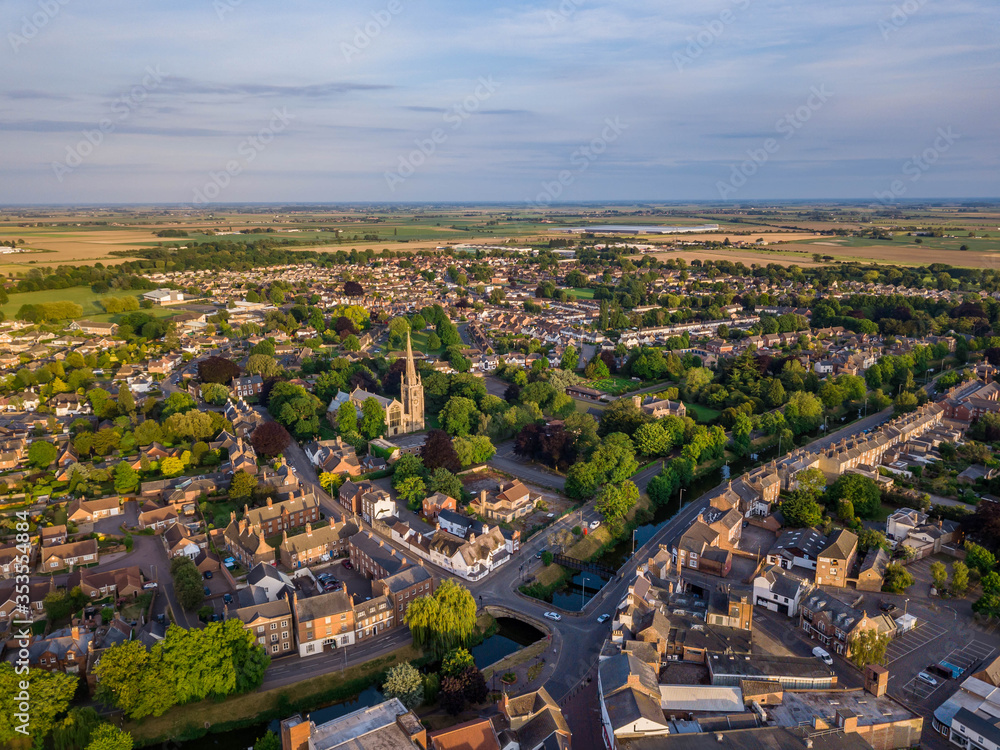 Aerial drone view of Spalding Stonegate clay lake including The Parish Church of Saint Mary and Saint Nicolas, South Holland Centre and River Welland