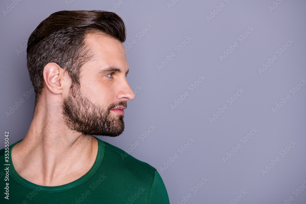 Fototapeta premium Closeup profile photo of macho attractive guy perfect appearance neat hairdo groomed bristle look side empty space wear casual green t-shirt isolated grey color background