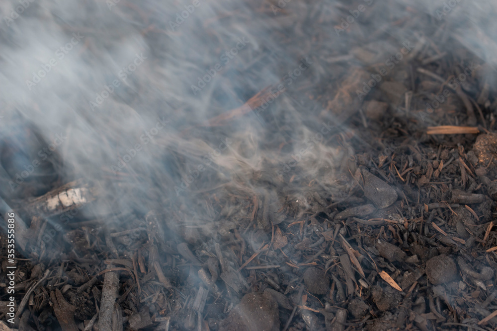 gray smoke on coals as a background